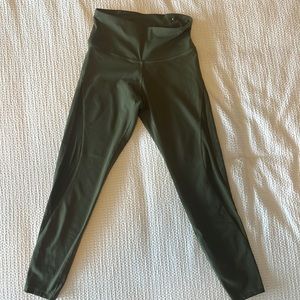 Full-length olive green leggings with mesh siding